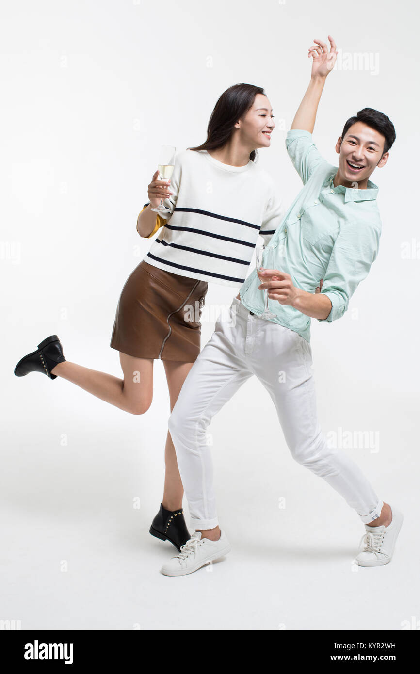 Cheerful young couple drinking champagne Stock Photo