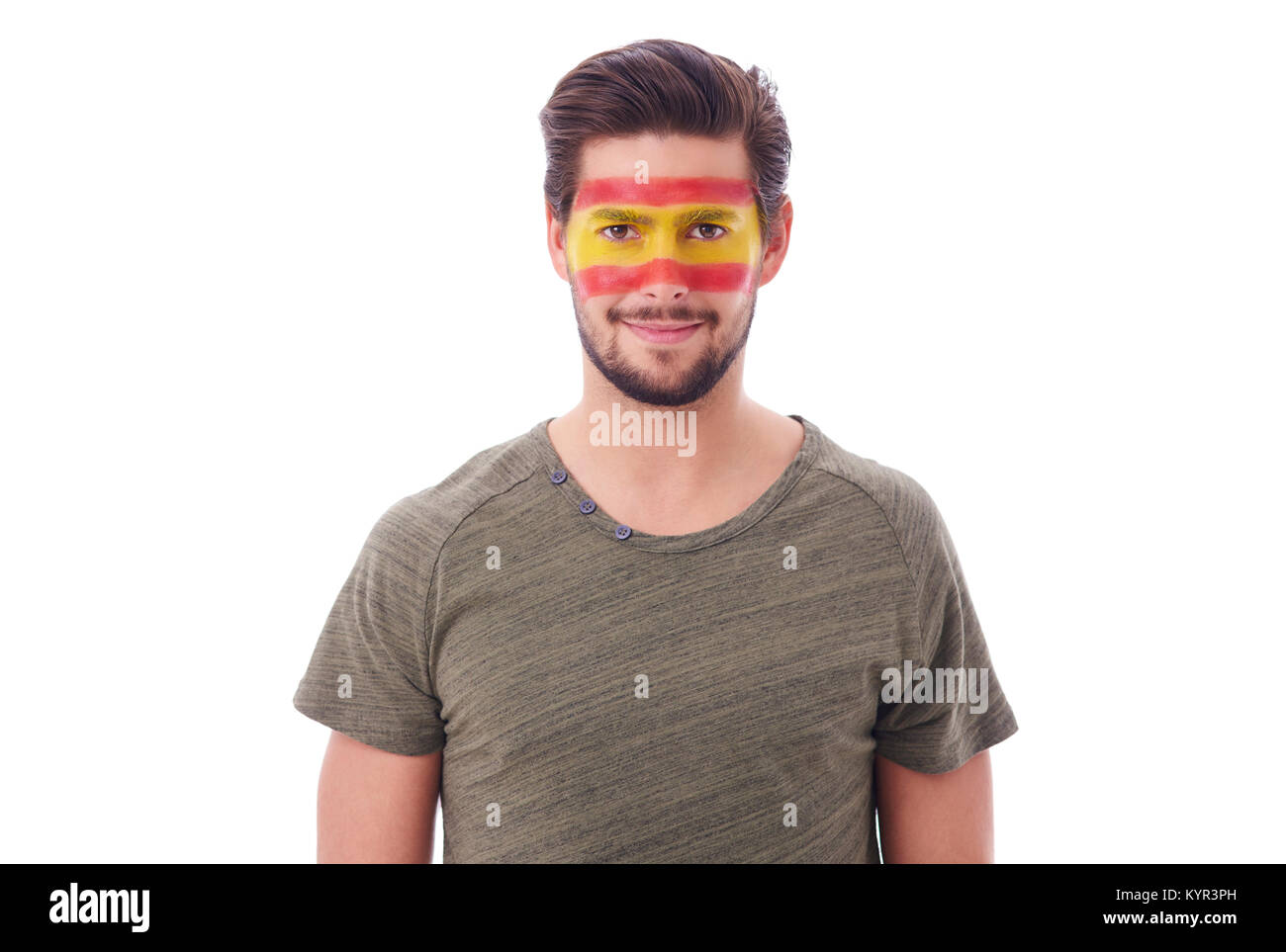 Portrait of cheerful man with spanish flag on face Stock Photo