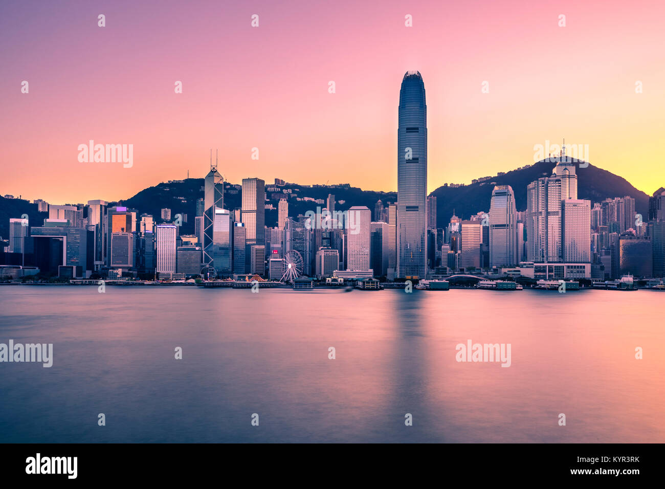 Victoria Harbor of Hong Kong at twilight Stock Photo