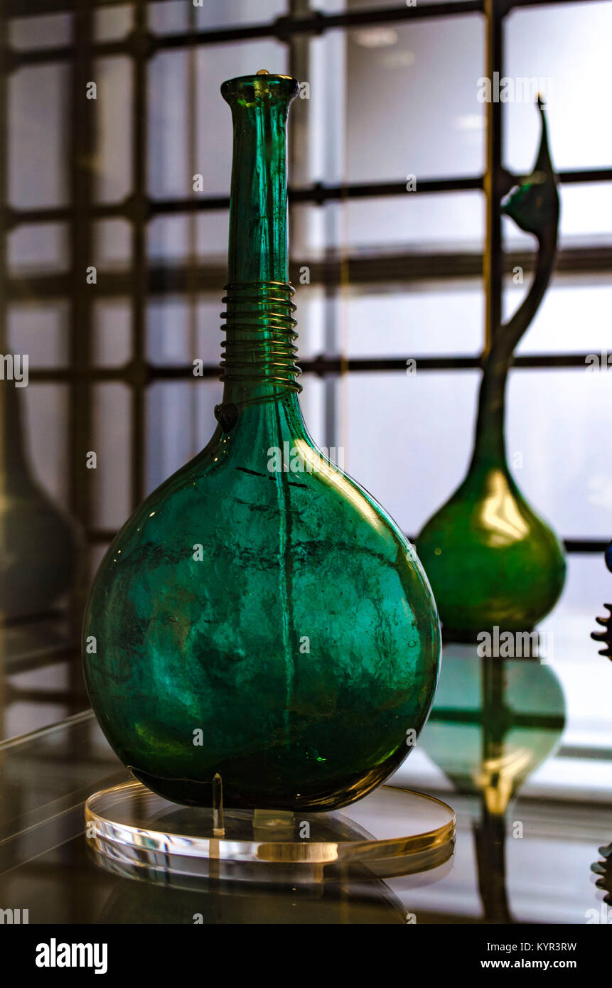 Green glass bottle with trailed ornament around the neck. Iran, maybe from Shiraz. 18th century. Victoria and Albert Museum, London, England. Stock Photo