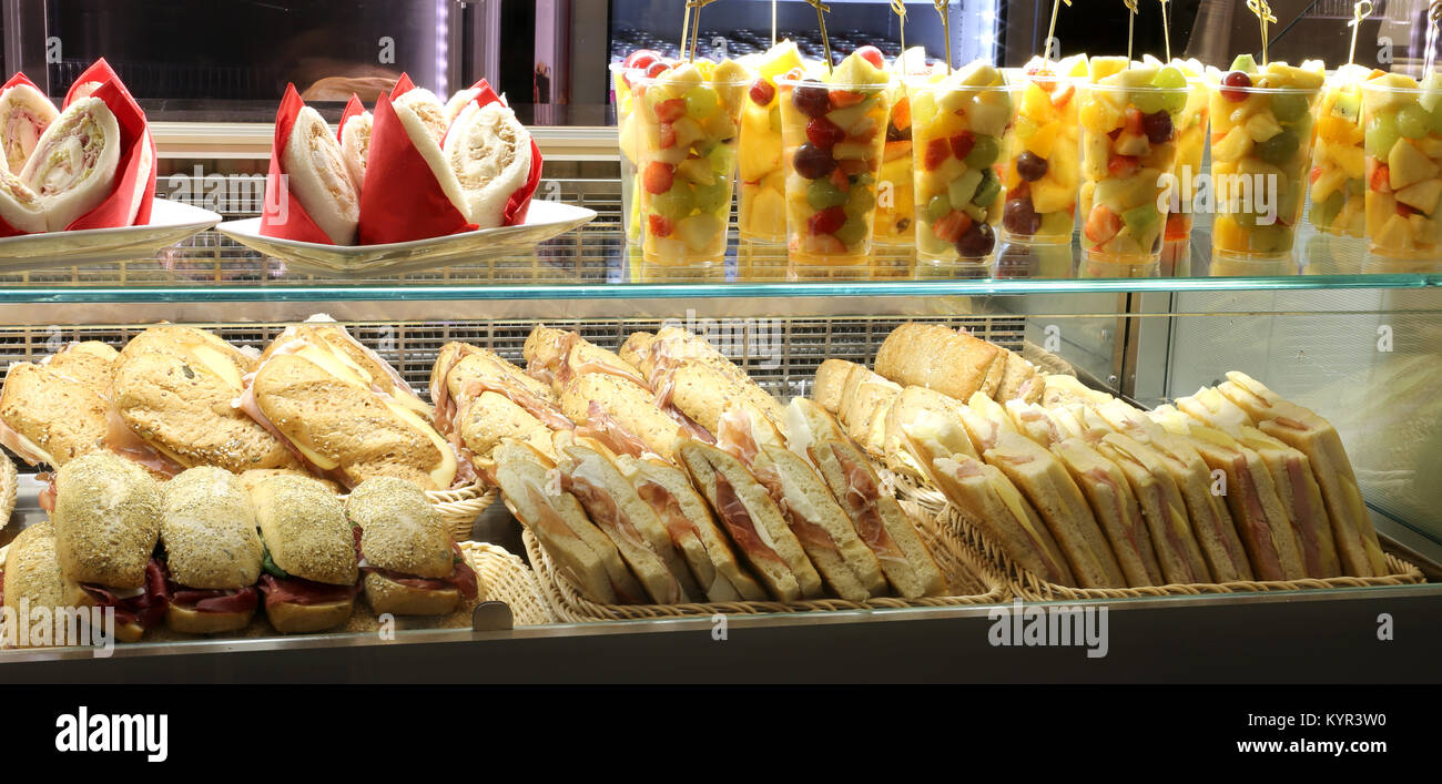 bar with lots of sandwiches and salad fruites for sale Stock Photo