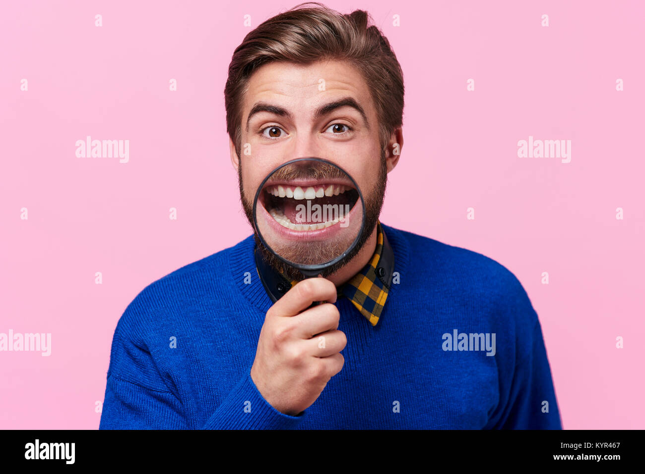 Man showing teeth for examination Stock Photo - Alamy