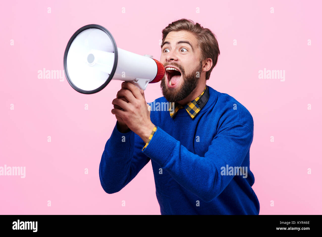 Man yelling into a megaphone Stock Photo