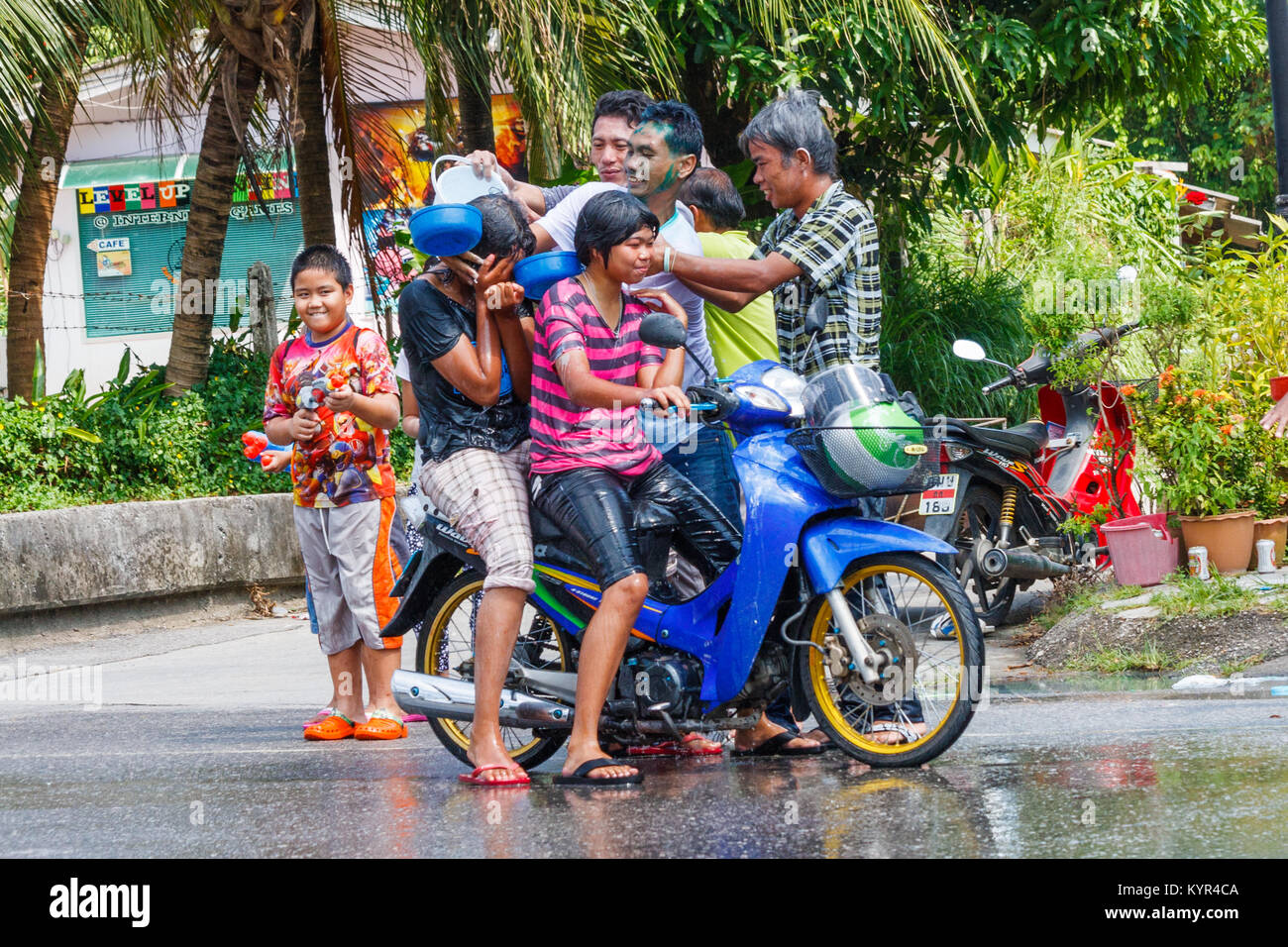 Thais celebrating Songkran New Year water festival, Phuket, Thailand Stock Photo