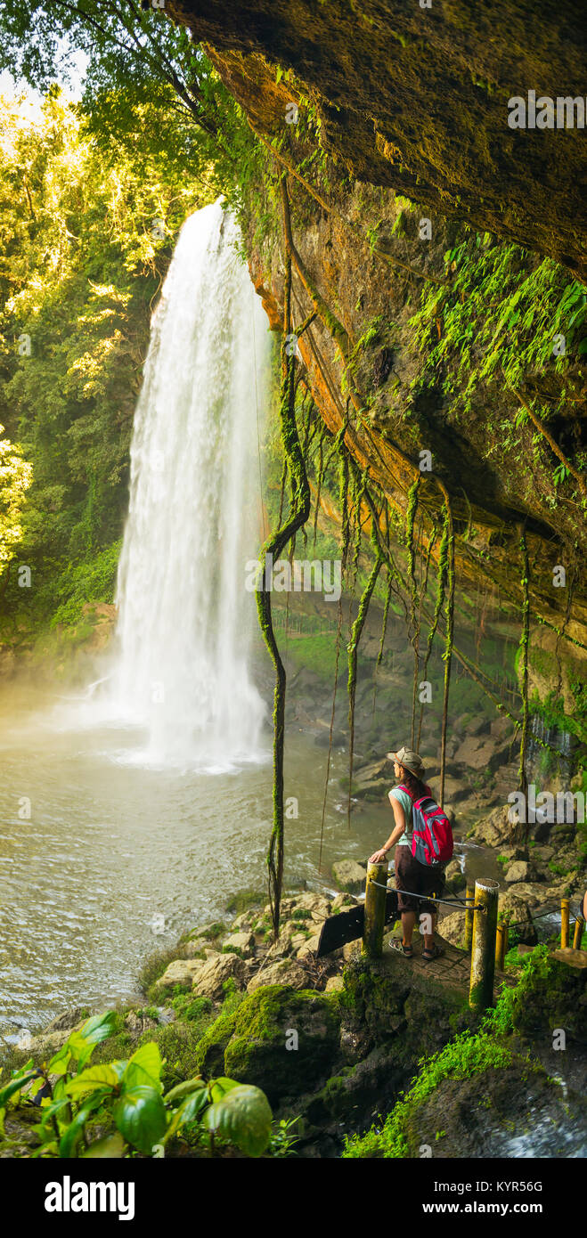 CHIAPAS, MEXICO - NOVEMBER 30: Unidentified tourist on walking path looking at Misol Ha Waterfall on November 30, 2016 near Palenque in Chiapas, Mexic Stock Photo