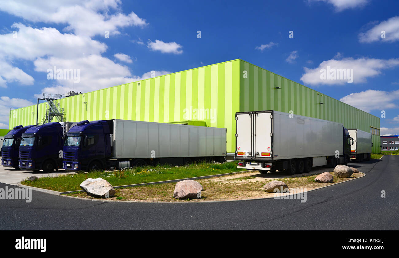 Trucks at the warehouse of a forwarding agency are loaded with goods Stock Photo