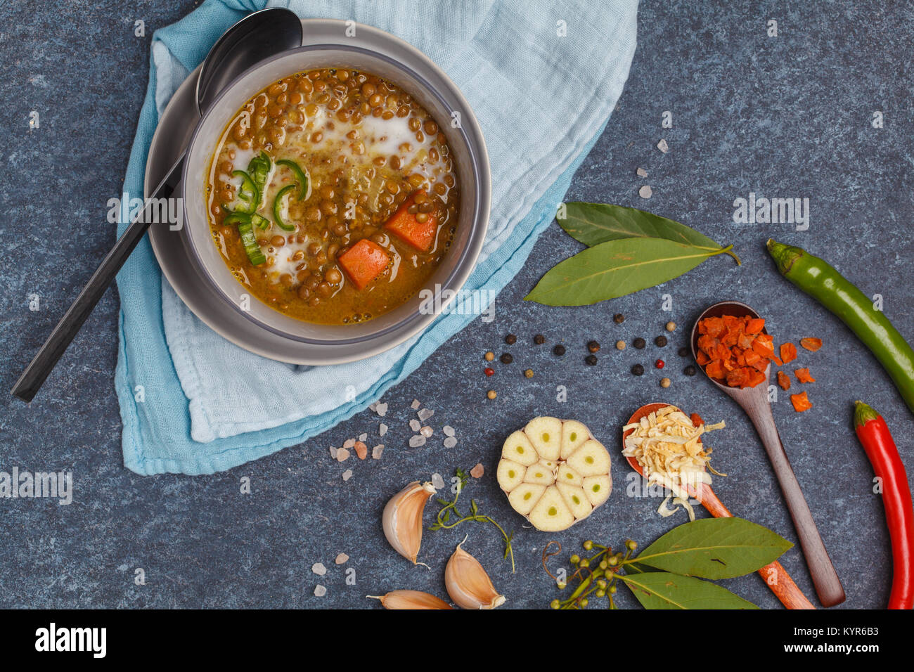 Indian vegetarian lentil soup, mung dal. Indian food spice concept. Dark background, top view. Stock Photo