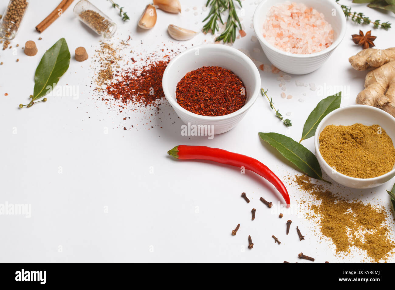 Selection of spices herbs and greens. Ingredients for cooking. White