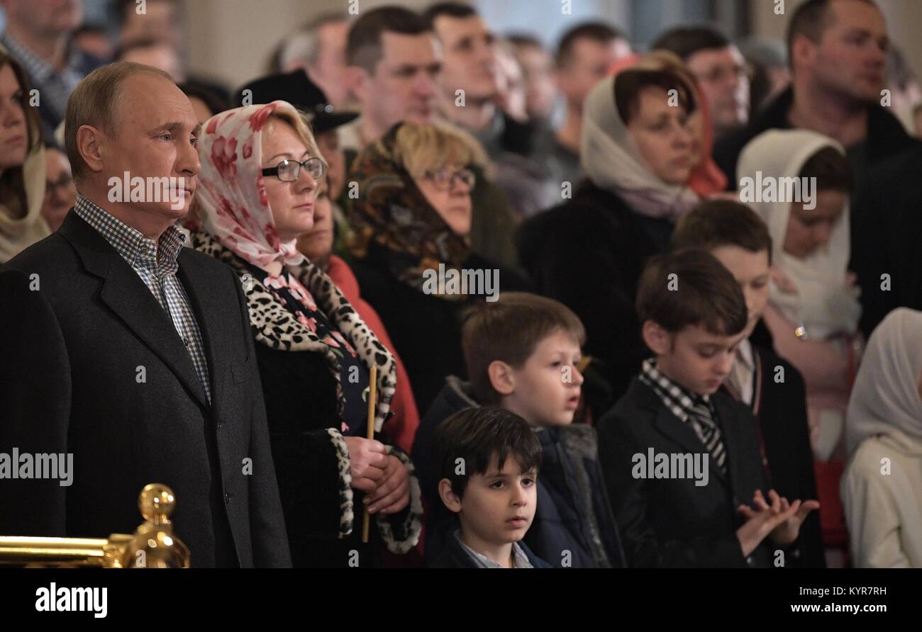 Russian President Vladimir Putin during Orthodox Russian mass celebrating Christmas at the Church of St. Simeon and Anna January 7, 2018 in St. Petersburg, Russia. Stock Photo