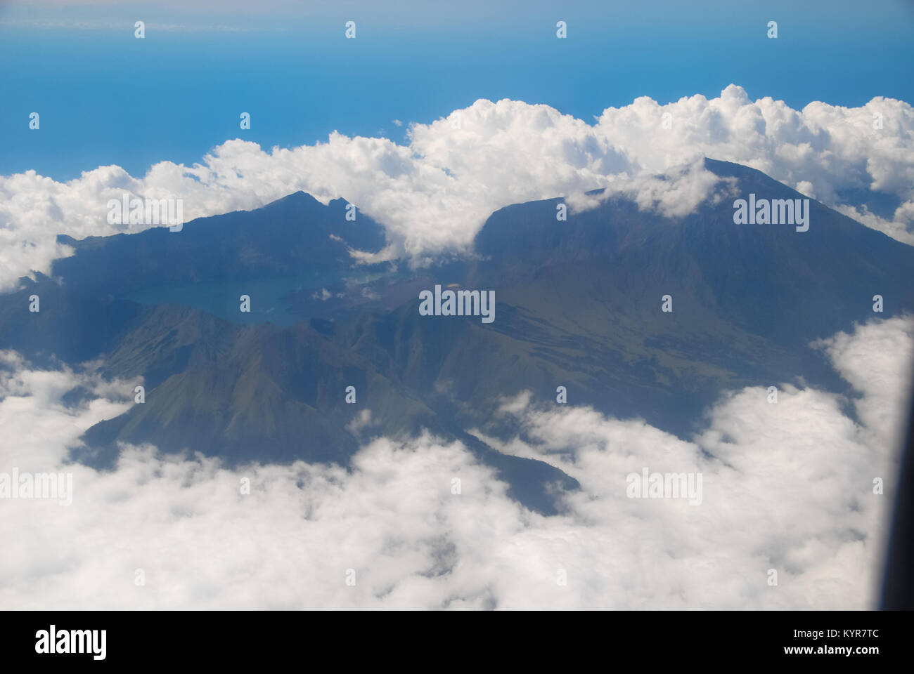 volcano with clouds at Sumbawa, seen from out of airplane Stock Photo