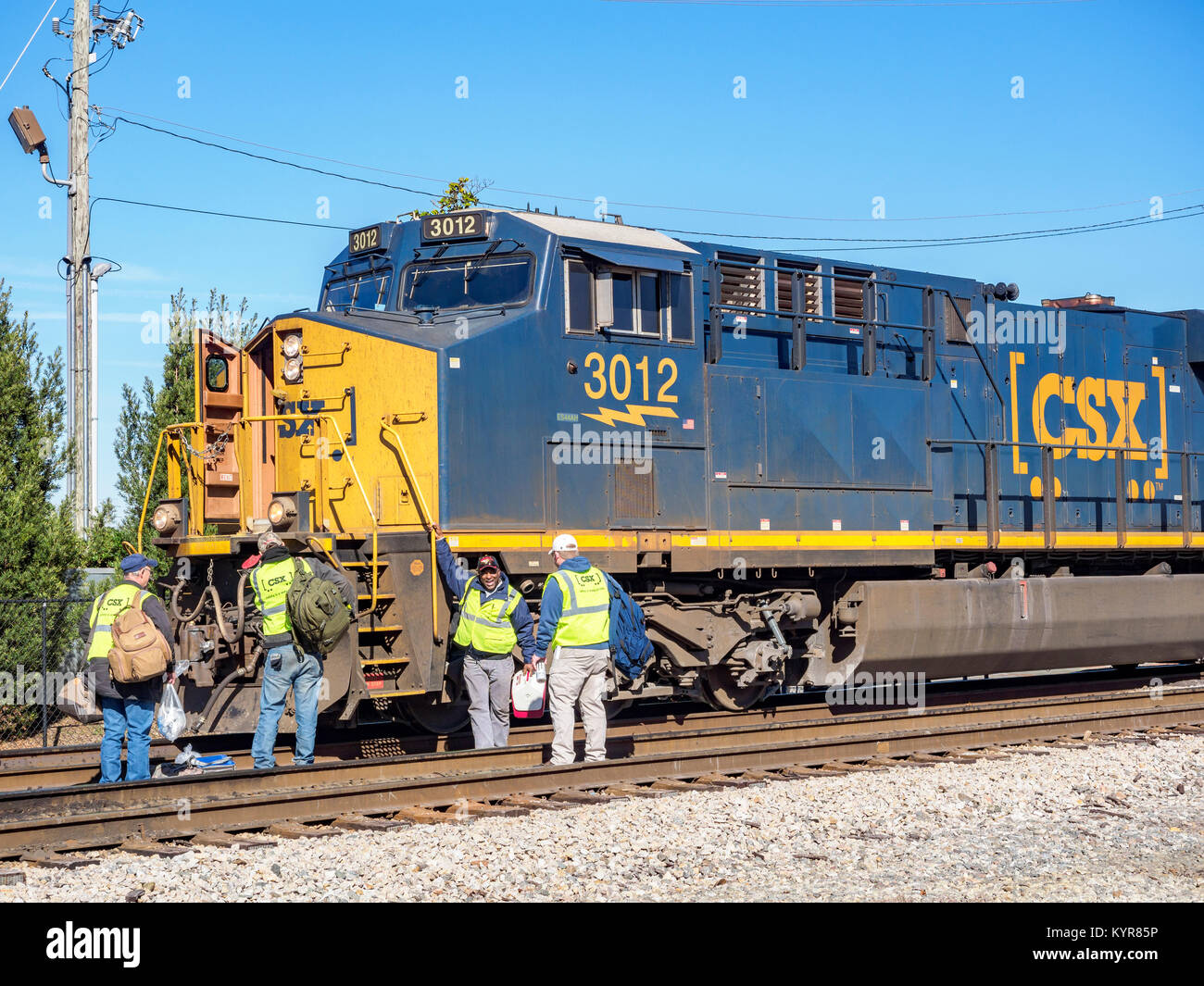 Crew members wait to board CSX Transportation diesel locomotive #3012 an evolution series GE ES44AH in Montgomery Alabama, USA. Stock Photo