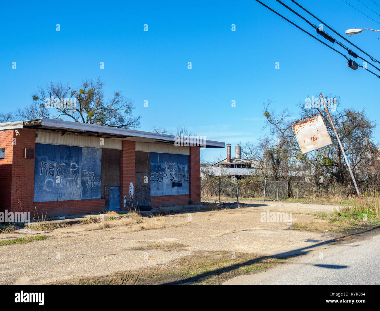 Old boarded up and shuttered small business showing urban decline in Montgomery, Alabama United States. Stock Photo