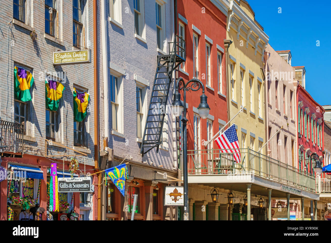 Colorful row houses in the French Quarter of downtown New Orleans, Louisiana, USA during Mardi Gras Stock Photo
