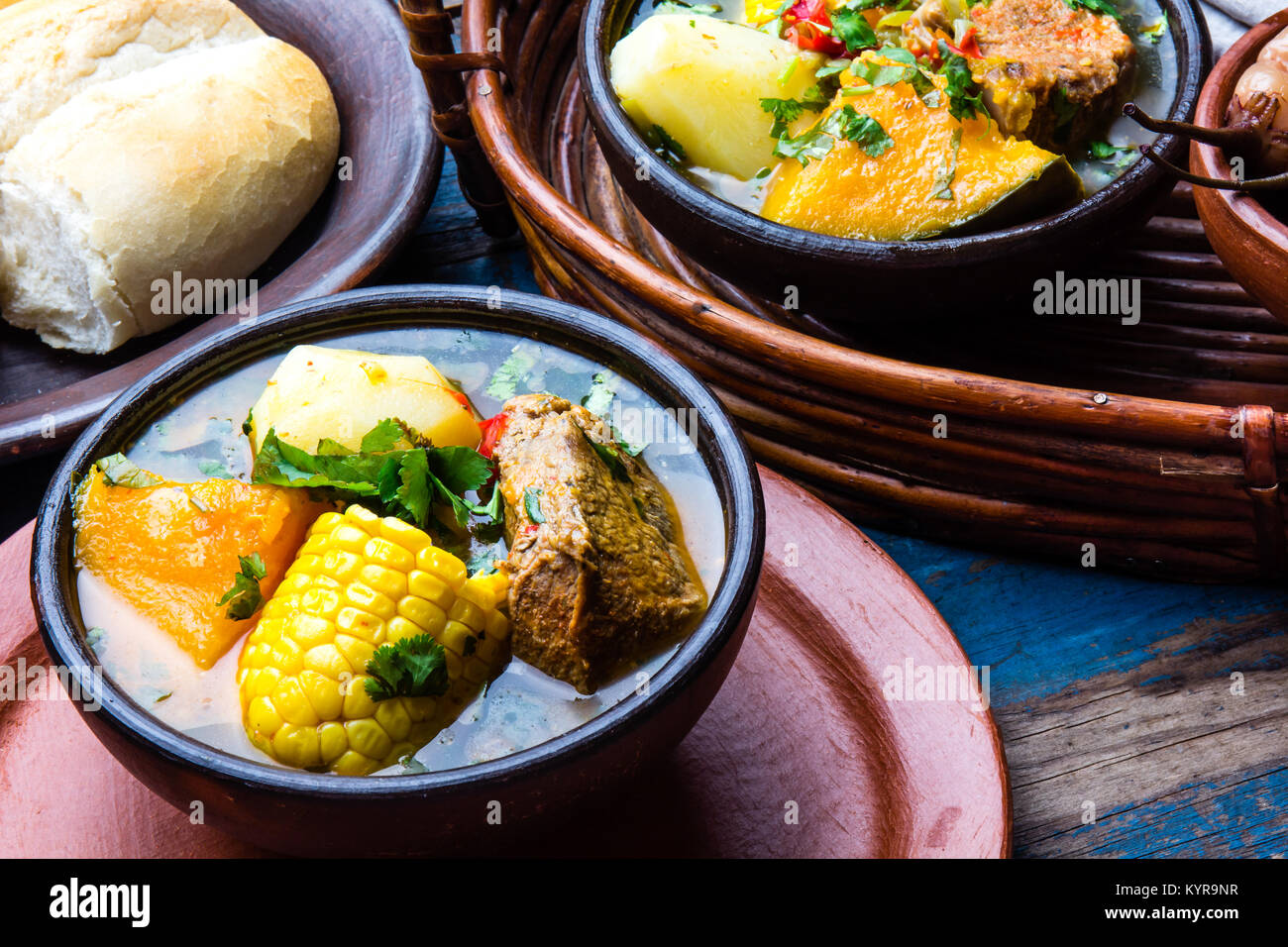 Latin American chilean food. Traditional chilean cazuela de cerdo with chuchoca. Pork soup with potatoes, pumpkin. corn served in clay bowl from Pomai Stock Photo