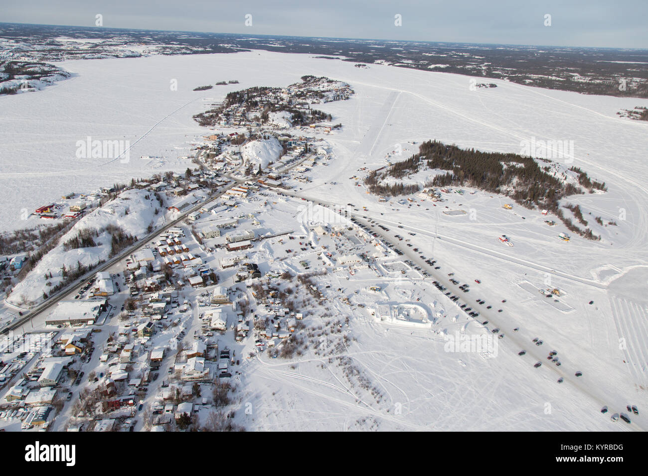Aerial view of Yellowknife in winter, with the Long John Jamboree and Snow King Festival taking place on Great Slave Lake, Northwest Territories. Stock Photo
