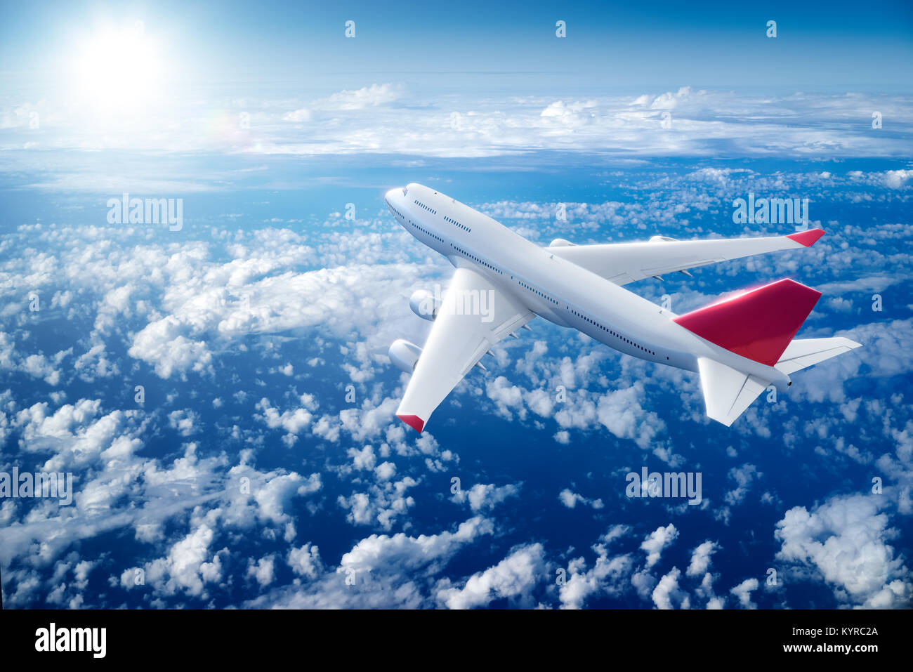 Airplane flying above clouds Stock Photo - Alamy
