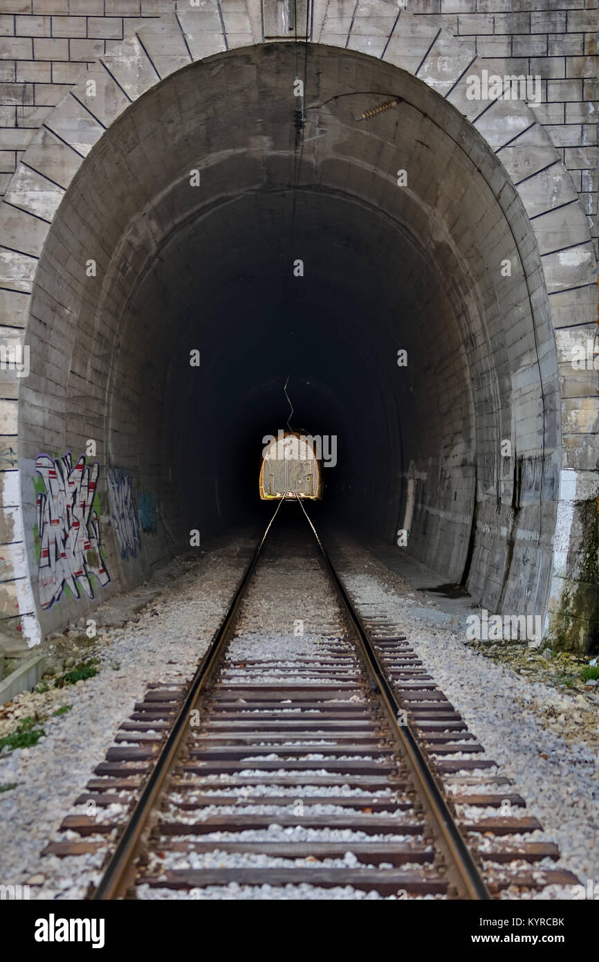 Tunnels and railways. Light on the end of the tunnel Stock Photo - Alamy
