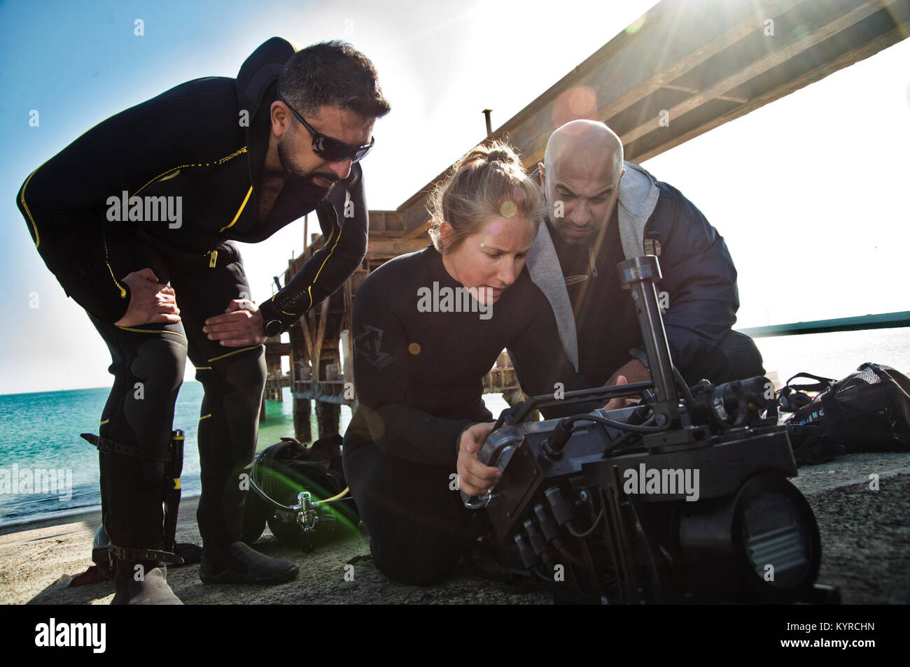 Mohammed Al-Ahmad Naval Base, KUWAIT (Jan. 8, 2018) Explosive Ordnance Disposal Technician 3rd Class Carolyn Willeford, assigned to Commander, Task Group 56.1, explains the basic functions of an underwater navigation system to Kuwait Naval Force explosive ordnance disposal technicians during a training evolution as part of exercise Eager Response 18. Eager Response 18 is a bilateral explosive ordnance disposal military exercise between the State of Kuwait and the United States. The exercise fortifies military-to-military relationships between the Kuwait Naval Force and U.S. Navy, advances the  Stock Photo