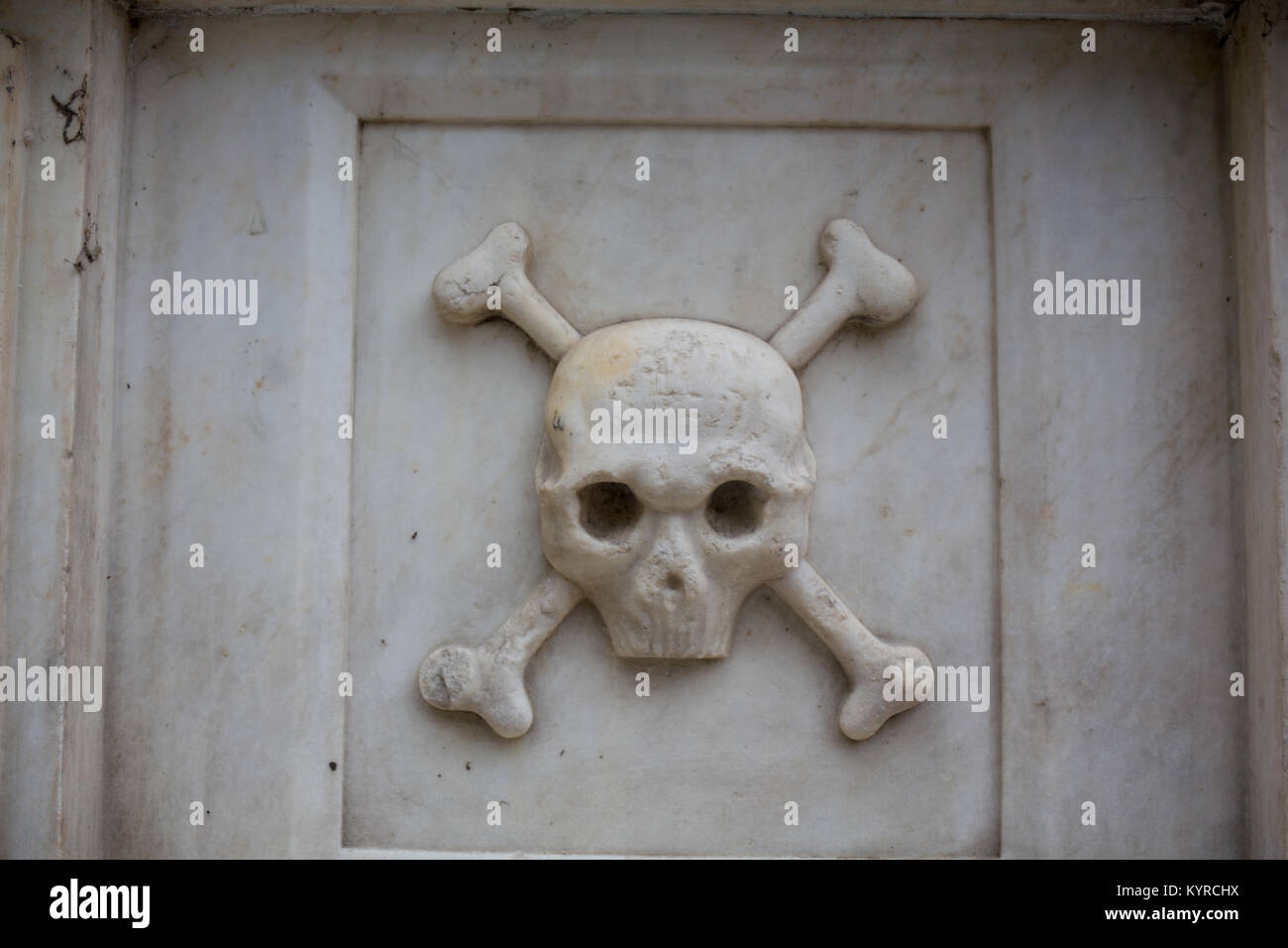 Skull and bones on the tomb in Bulgaria. Stock Photo