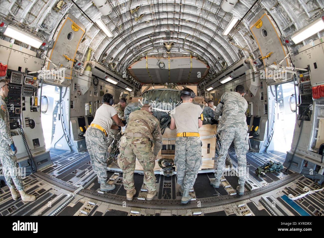 POPE ARMY AIRFIELD, N.C. — Airmen and Soldiers load cargo on a 437th Airlift Wing C17