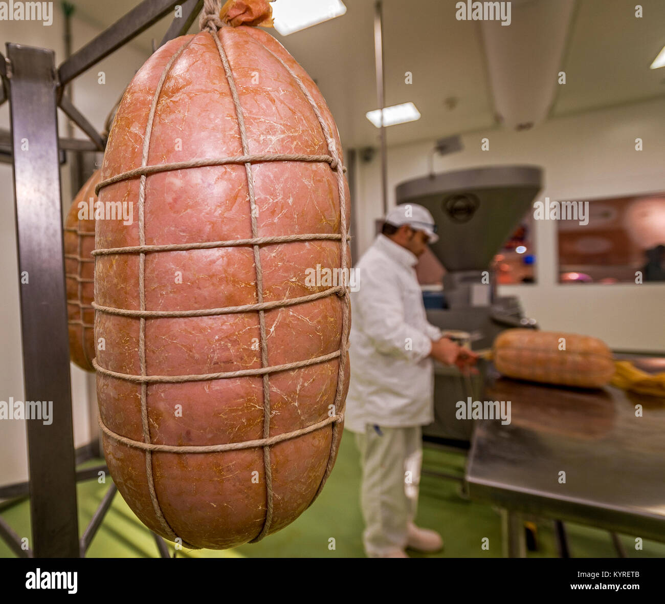 Various phases of the processing of mortadella hires stock photography