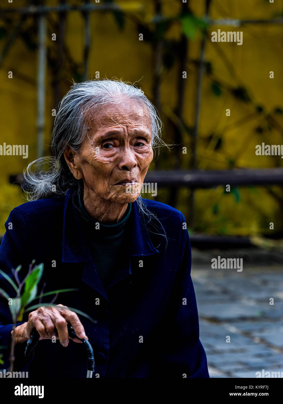 Old lady in Hoi An. Stock Photo