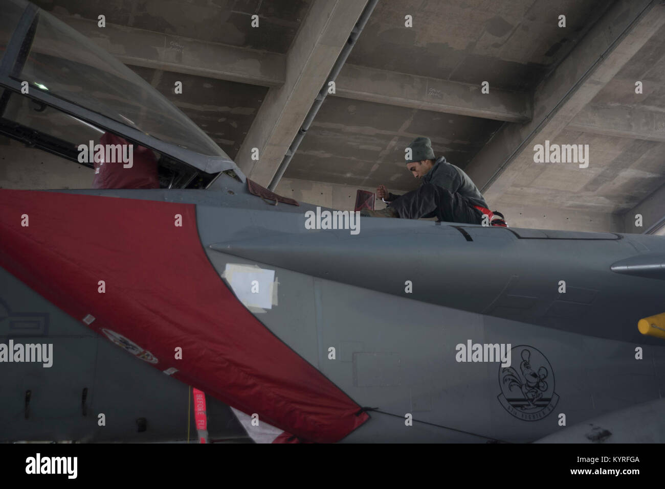 U.S. Air Force Senior Airman Devin Moore, 67th Fighter Squadron crew chief, checks and installs a panel on an F-15 Eagle Jan. 11, 2018, at Kadena Air Base, Japan. Aircraft assigned to Kadena support a variety of missions and exercises throughout the Indo-Asia Pacifica area of responsibility. (U.S. Air Force Stock Photo