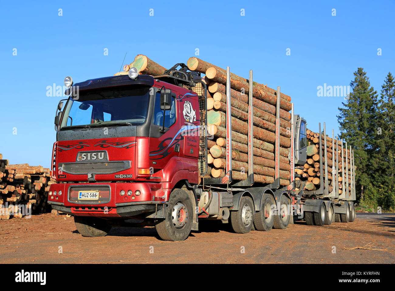 LUVIA, FINLAND - SEPTEMBER 19, 2014: Sisu 18E630 Timber truck at sawmill lumber yard ready to unload. The Finnish Sisu Truck has Caterpillar C18 Engin Stock Photo
