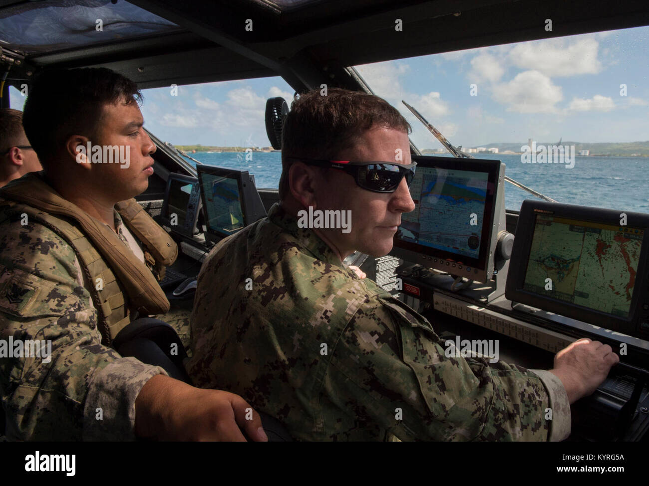 U.S. Navy Electronics Technician 2nd Class Jairio Diaz, left, and Lt