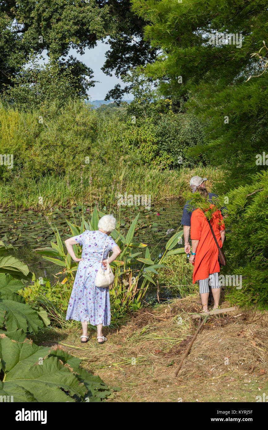 Visitors explore the gardens at Great Dixter, designed by Christopher Lloyd at Northiam, East Sussex, UK Stock Photo