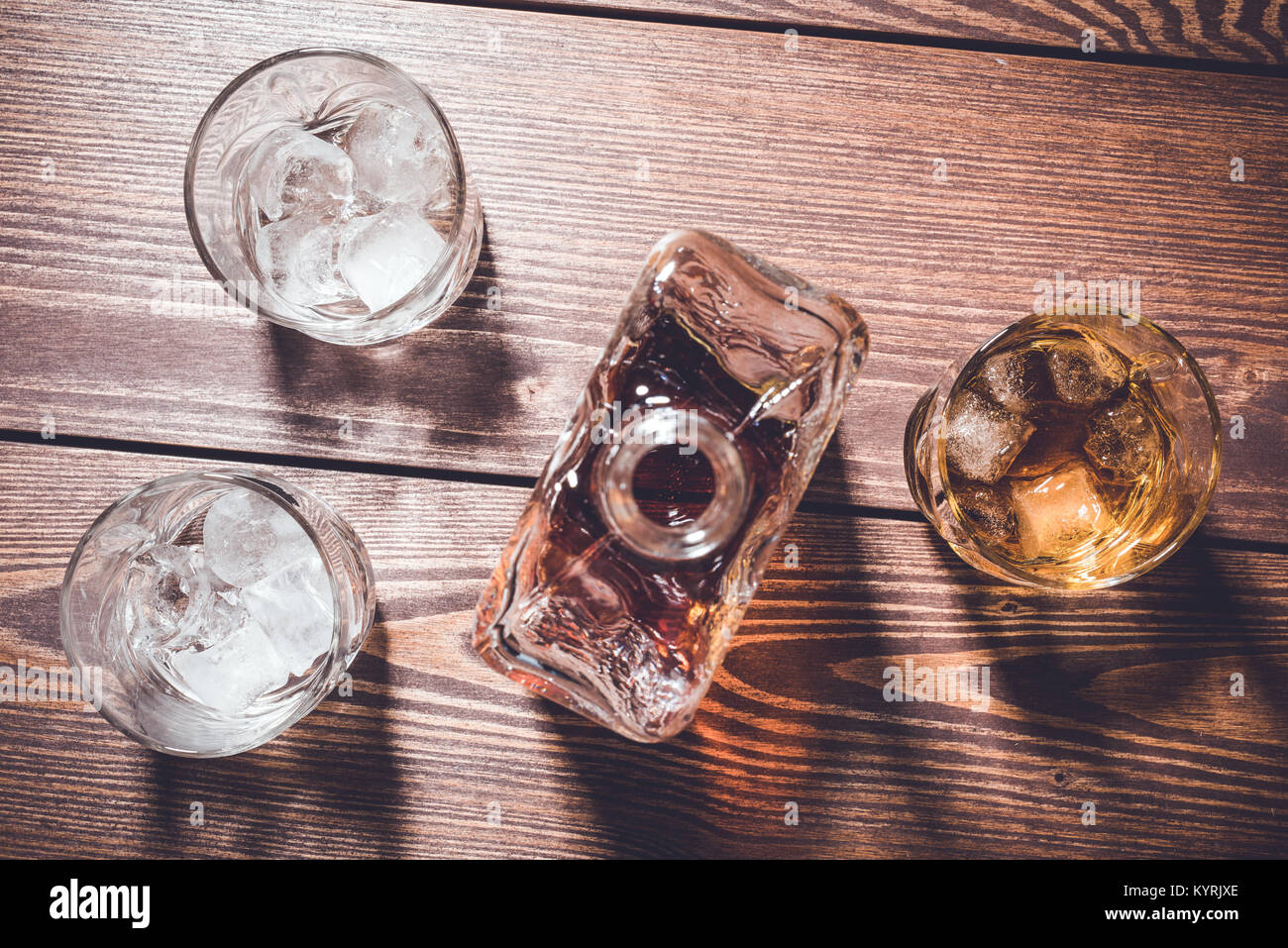 Download Whiskey Bottle And Whiskey Glasses With Ice Cubes Top View Stock Photo Alamy PSD Mockup Templates