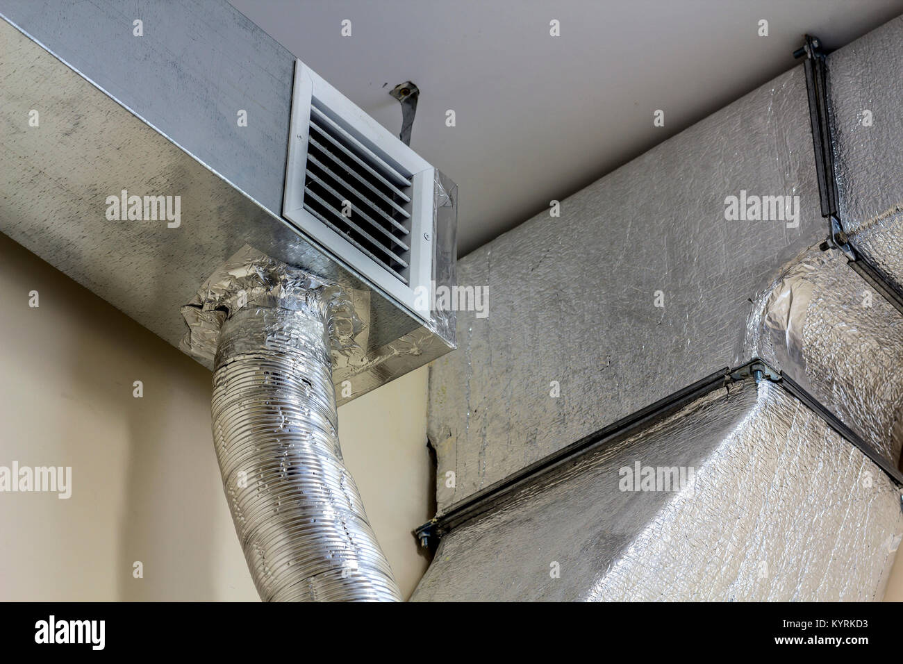 Industrial air duct ventilation equipment and pipe systems installed on  industrial building ceiling Stock Photo - Alamy