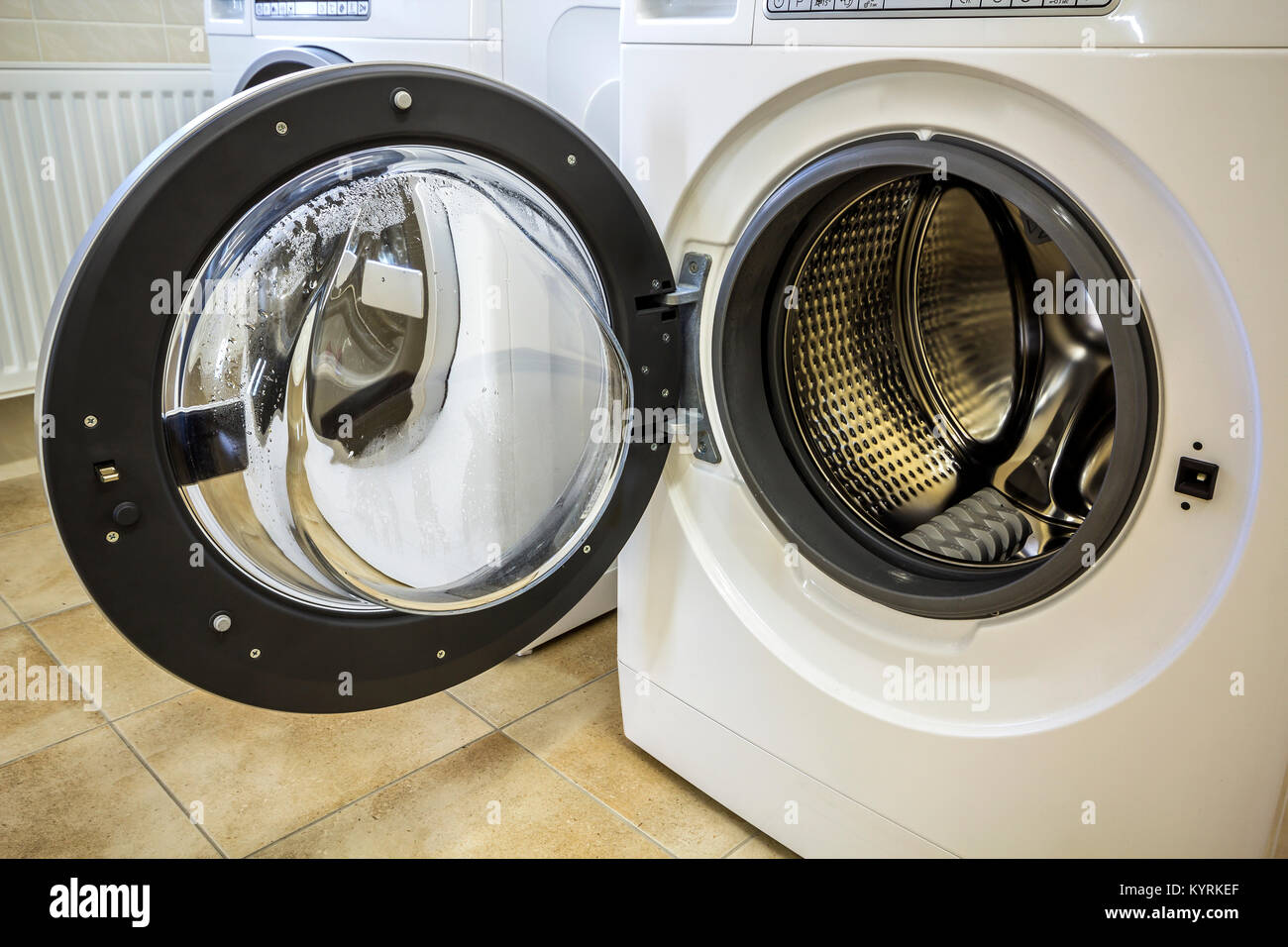 A close up of open washing machine in bathroom Stock Photo Alamy