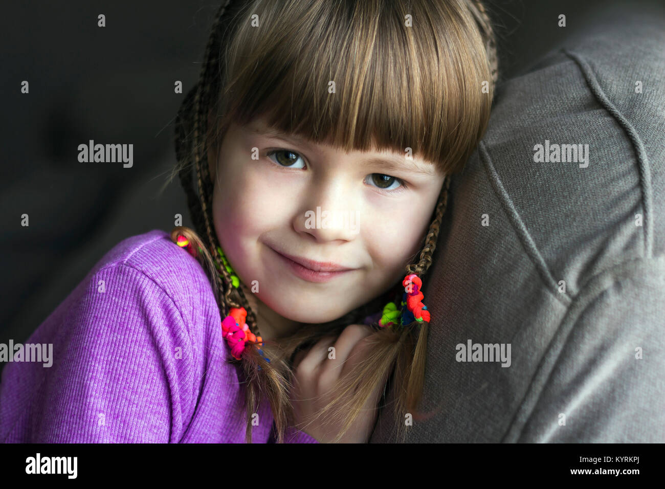 Portrait of pretty little girl with small braids Stock Photo - Alamy