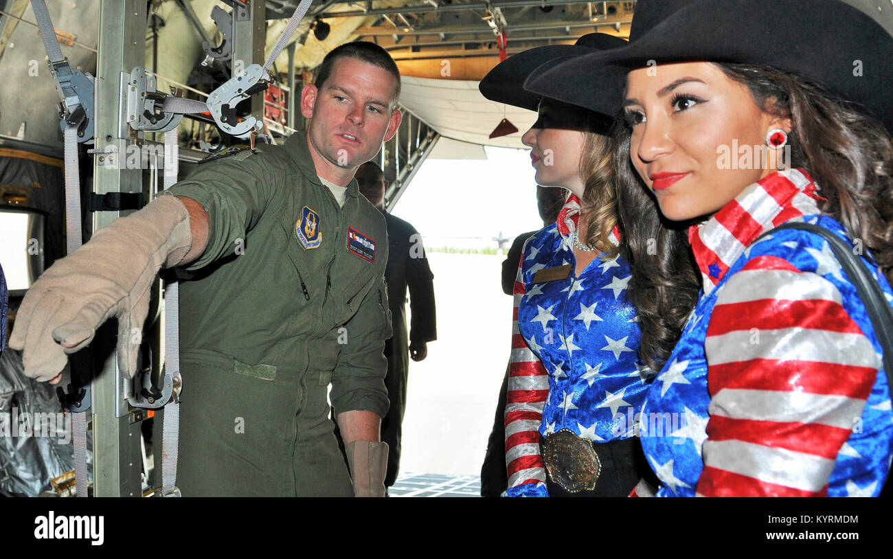 PETERSON AIR FORCE BASE, Colo. – Senior Master Sgt. Gary Taiclet, Operations Superintendent for the 34th Aeromedical Evacuation Squadron, explains to the 2017 Pikes Peak or Bust Rodeo ambassadors, the Girls of the West, how a C-130 Hercules configures to transport injured personnel. Girl of the West, Jaime Tyler, center, and her aide, Sierra Silva, right, visited the 302nd Airlift Wing June 28, 2017 to gain a better understanding of the Reserve mission here. (U.S. Air Force Stock Photo