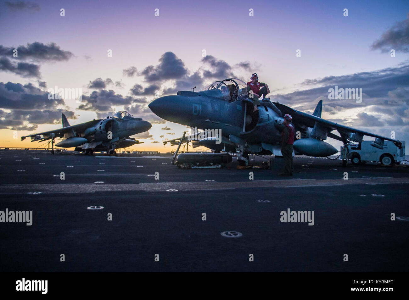 CORAL SEA (Aug. 3, 2017) Cpl. Noah During (cockpit), from Stratsburg, Pa., Cpl. Kirby Plummer (center), from Poland, Maine, and Lance Cpl. Jerry Chambers, from Greensborough, Ala., analyze computer logs of an AV-8B Harrier, assigned to the “Tomcats” of Marine Attack Squadron (VMA) 311, on the flight deck of the amphibious assault ship USS Bonhomme Richard (LHD 6). Bonhomme Richard, flagship of the Bonhomme Richard Expeditionary Strike Group (ESG), is operating in the Indo-Asia-Pacific region to enhance partnerships and be a ready-response force for any type of contingency. (U.S. Navy Stock Photo
