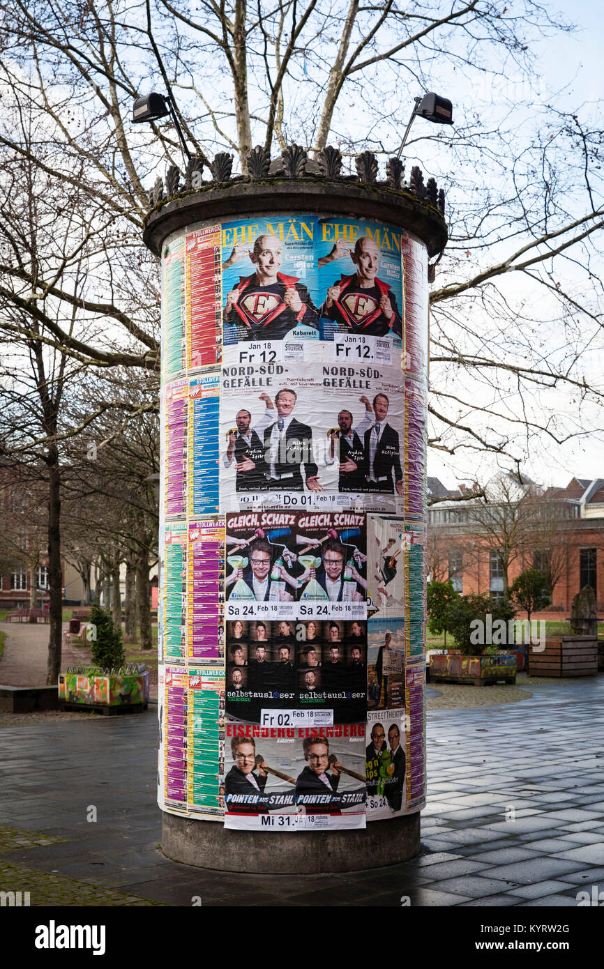 Europe, Germany, Cologne, advertising pillar with event notes in front of the Stollwerck house.  Europa, Deutschland, Koeln, Litfasssaeule mit Veranst Stock Photo