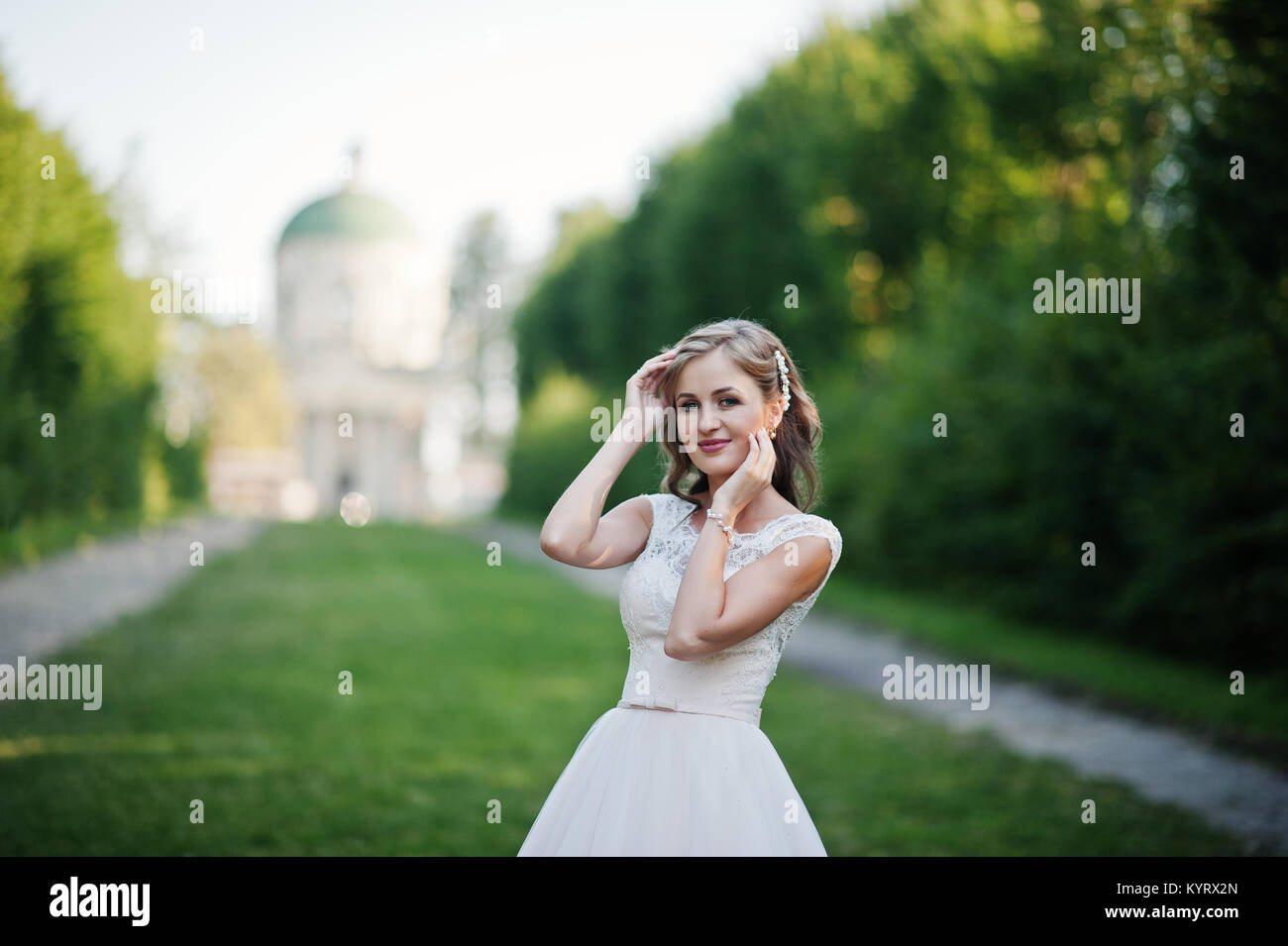 Bride looking into church hi-res stock photography and images - Alamy