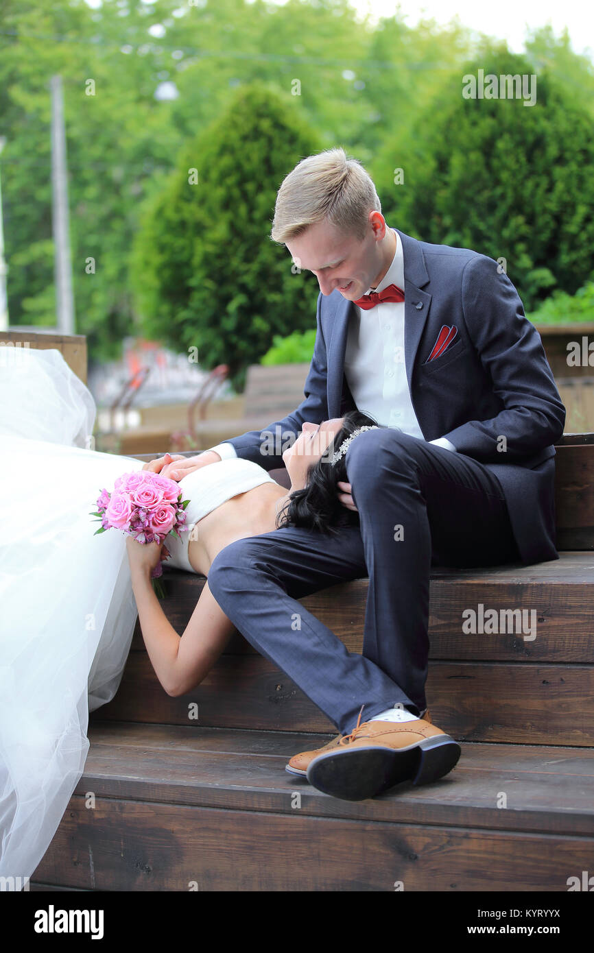 Bride And Groom Sitting Stock Photos & Bride And Groom Sitting Stock