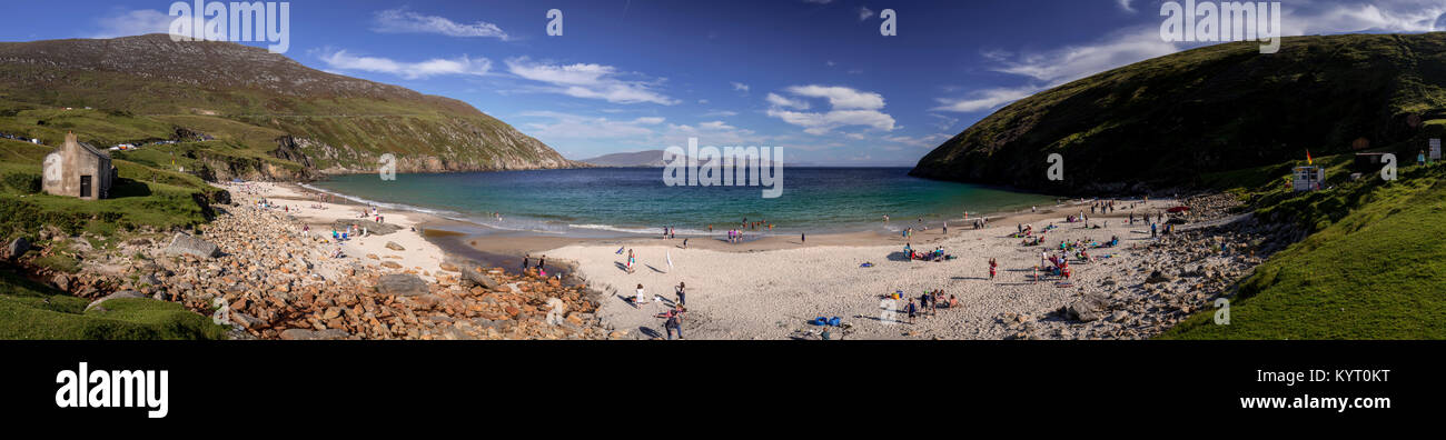 Panoramic view of holidaymakers in the sun onthe beach at Keem Bay, Achill Iland on the west coast of Ireland Stock Photo