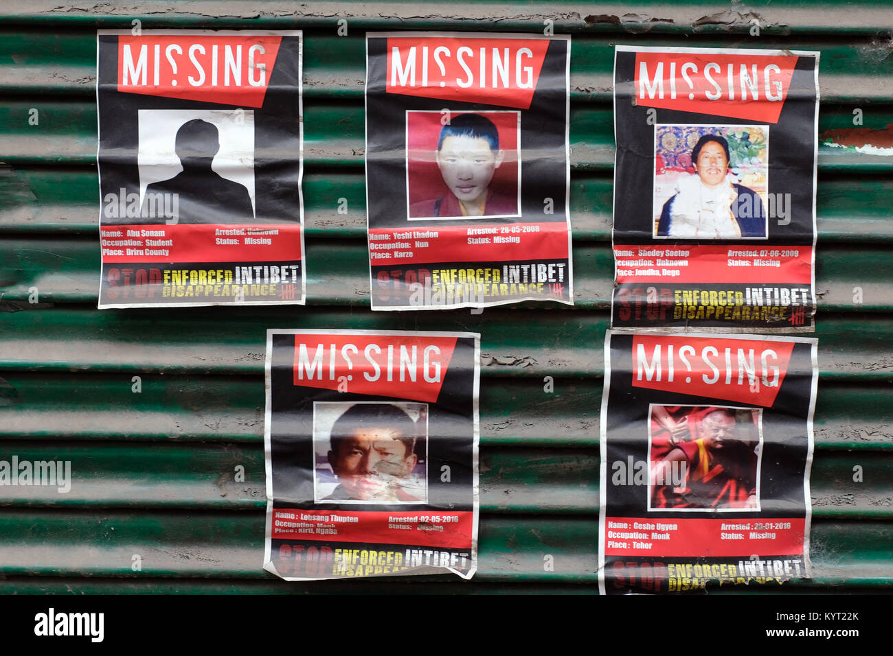 Posters of missing Tibetan activists, posted in Dharamshala, India, the home of The Tibetan Government in Exile Stock Photo