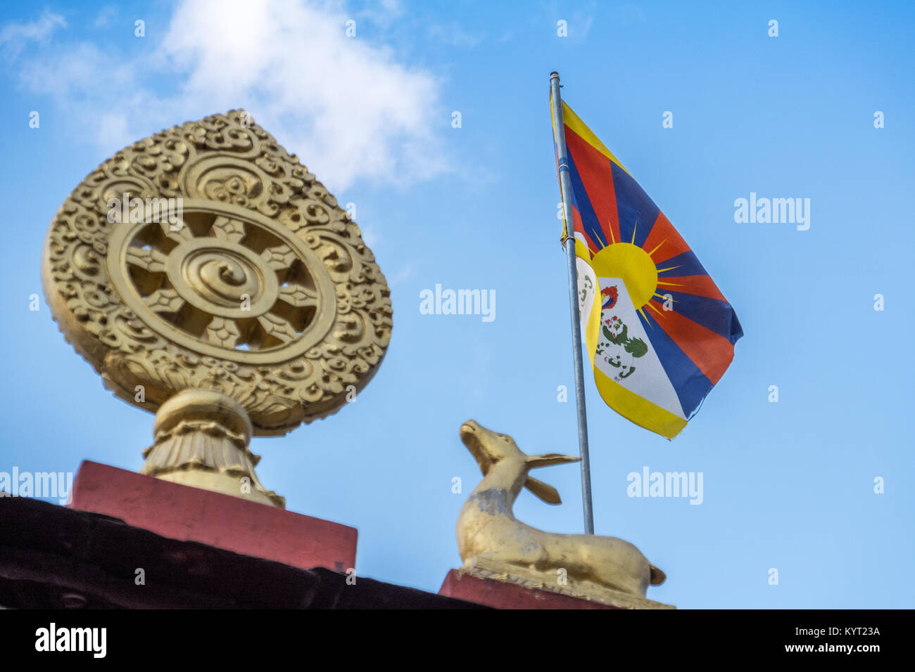 The Tibetan flag flying from the roof of a Buddhist temple in Daramshala, India Stock Photo