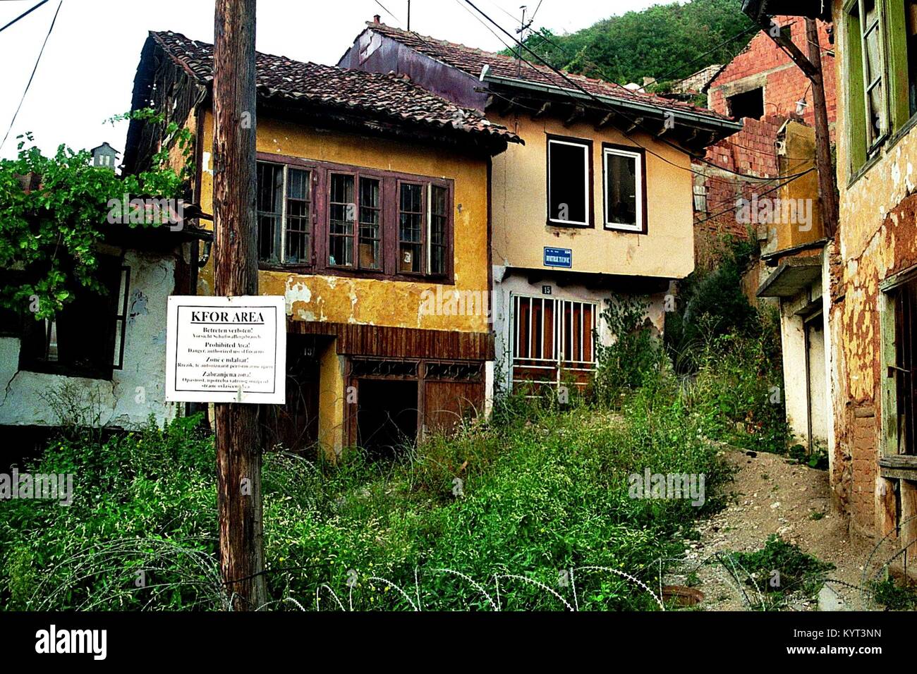The medieval town of Prizren (Kosovo, until 2008 part of Serbia) survived the war of 1999 without heavier damage, but in 2004 the Serbian quarter Potkaljaja was destroyed and burnt down by a mob. Potkaljaja was a not accessible area under the protection of NATO/KFOR. The picture shows the entrance to the Serbian part in August 2006. Stock Photo