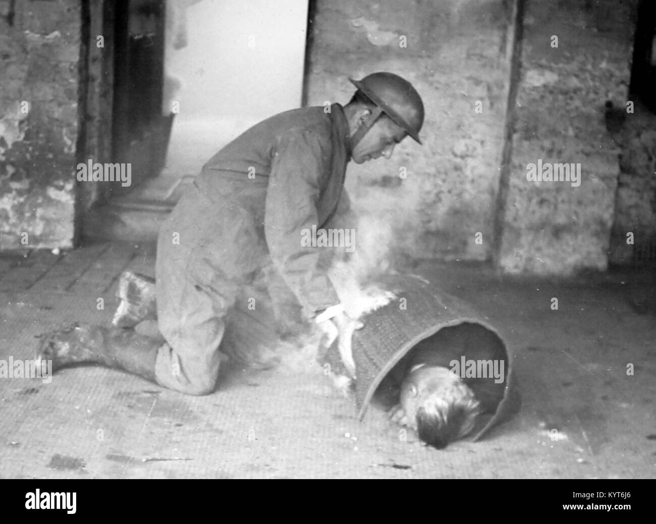 Helping someone on fire, ARP training exercise during WW2 Stock Photo