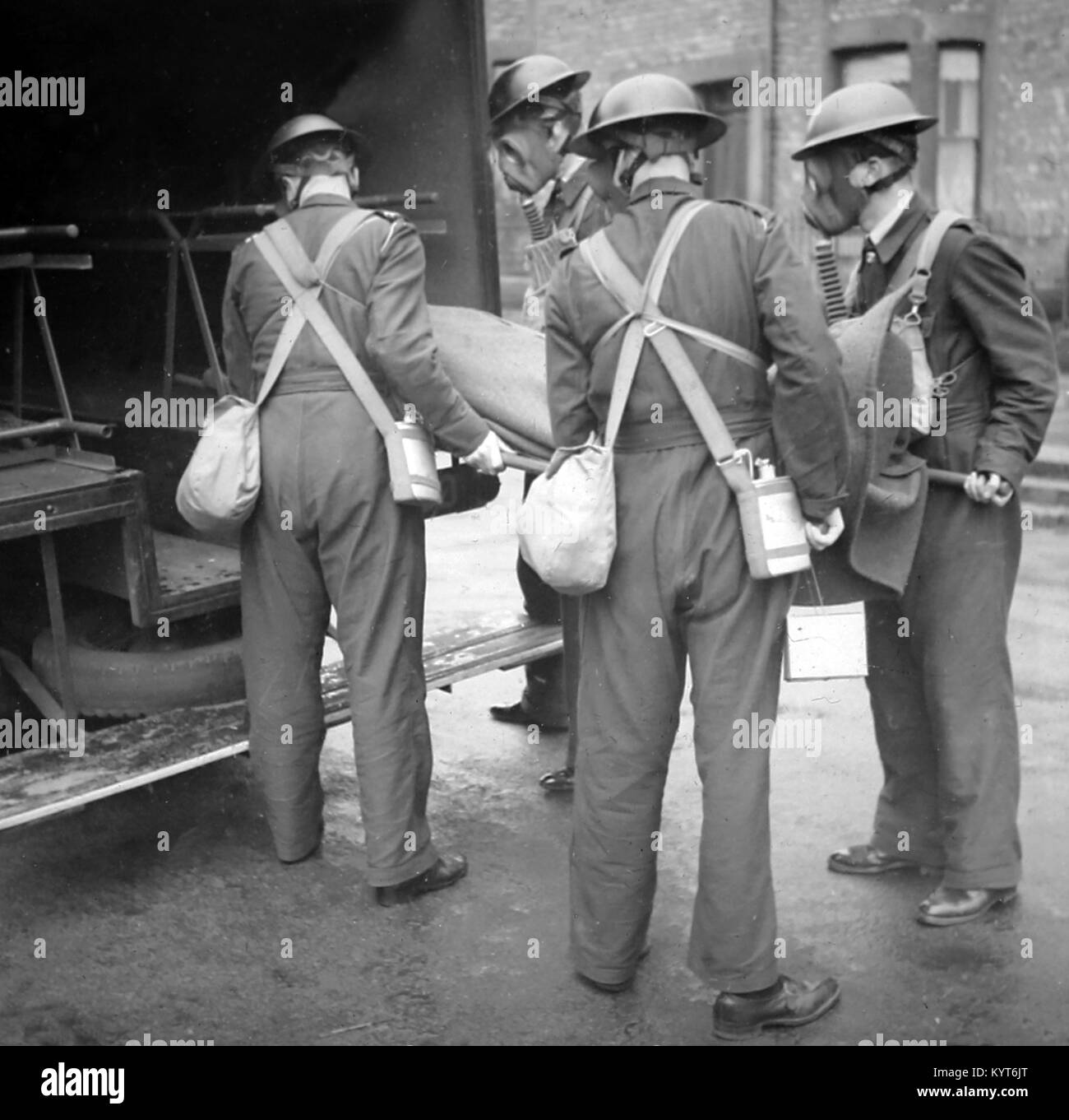 Loading an injured person into an ambulance, ARP training exercise during WW2 Stock Photo