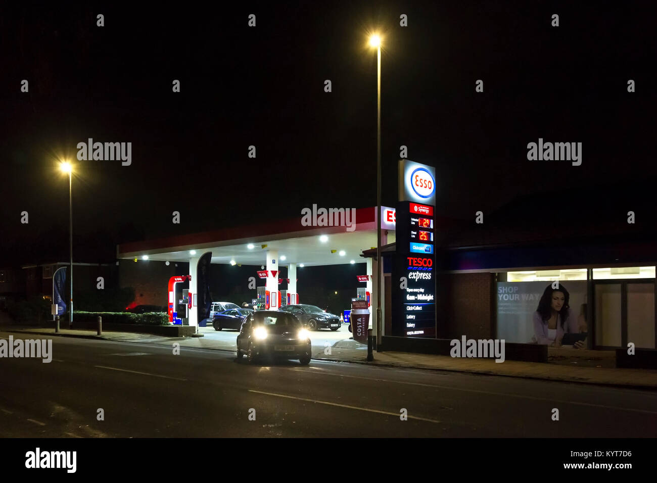 The ESSO Garage and Tesco Express on Wellingborough rd on a dark winters evening.  Northampton, Stock Photo