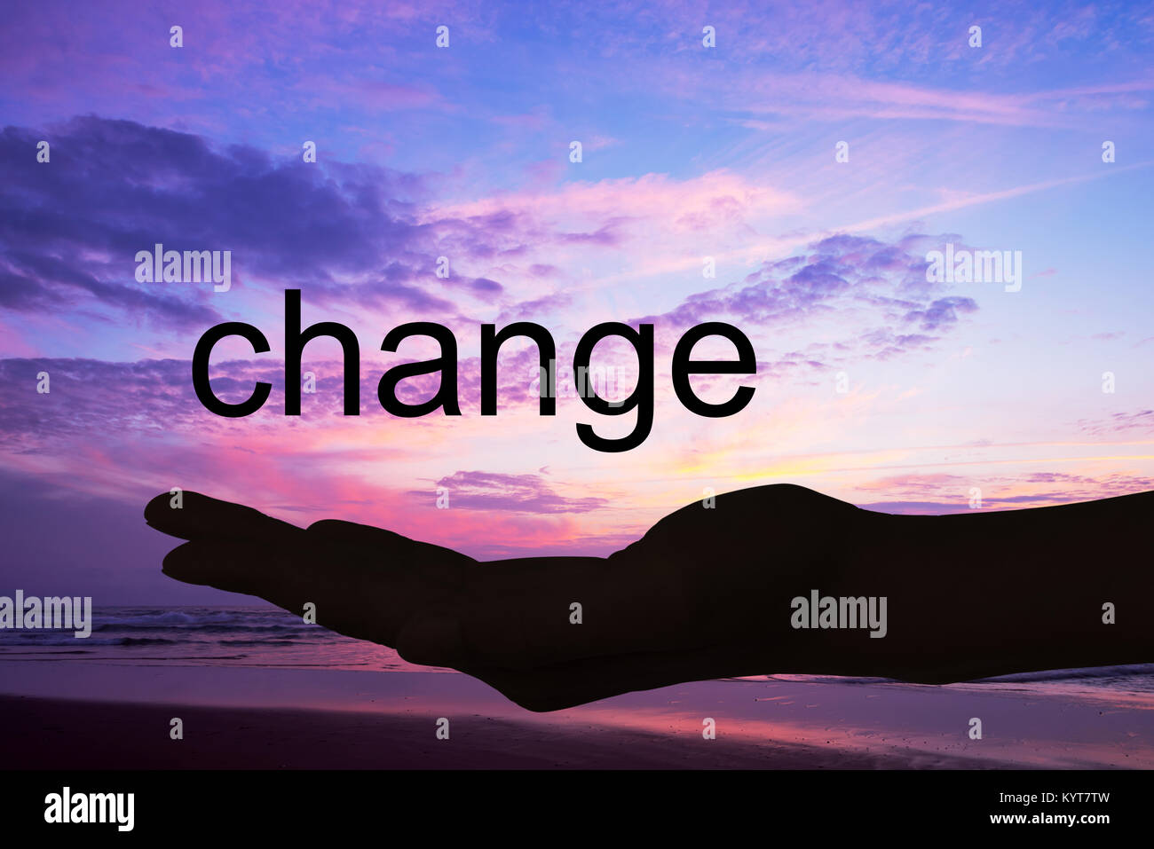 Hand offering the word change, sunset background Stock Photo