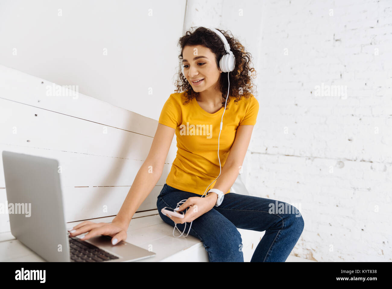 Charming young woman looking at computer Stock Photo