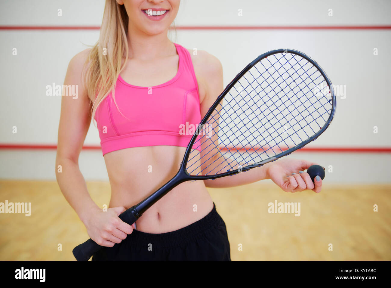 Unrecognizable squash player with racket Stock Photo