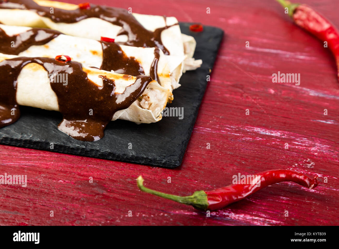 Mexican chicken enchiladas with chili chocolate salsa mole poblano